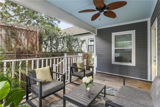 wooden terrace featuring ceiling fan