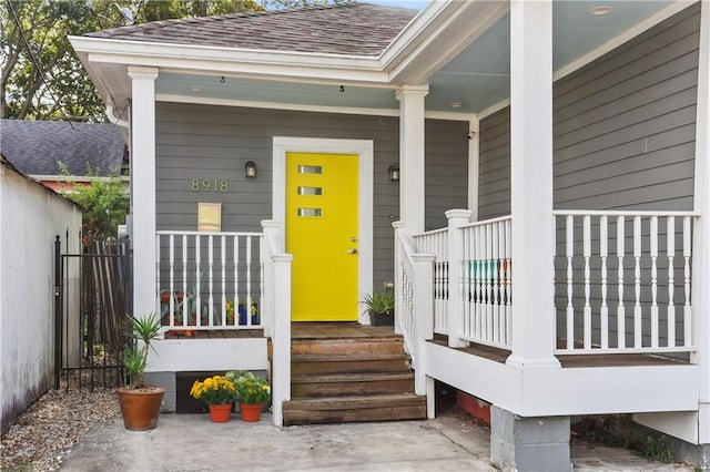 doorway to property featuring a porch