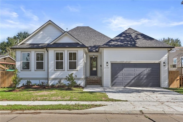 view of front of home featuring a garage and a front lawn