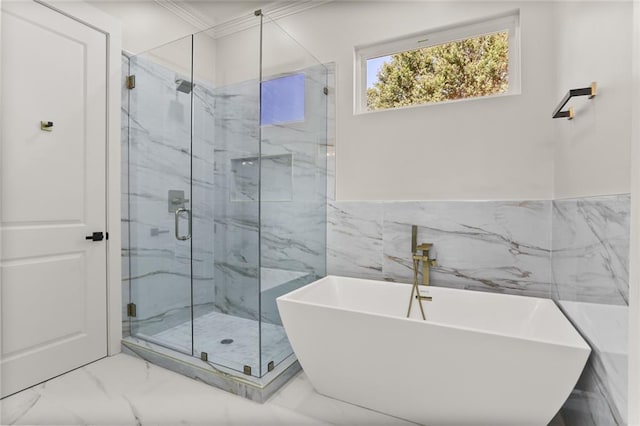 bathroom featuring independent shower and bath and tile walls