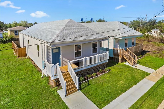 bungalow-style house with a porch and a front yard