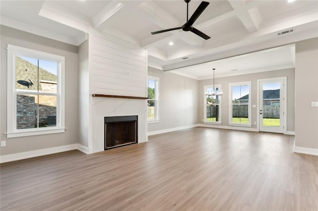 unfurnished living room with hardwood / wood-style floors, a fireplace, beamed ceiling, and coffered ceiling