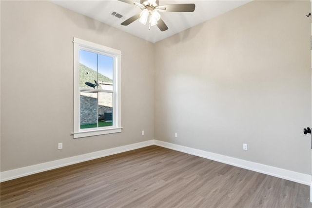 unfurnished room with ceiling fan and light wood-type flooring