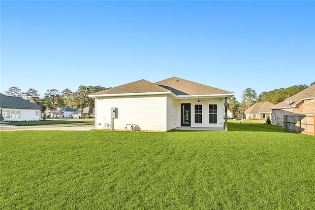 back of house featuring a yard