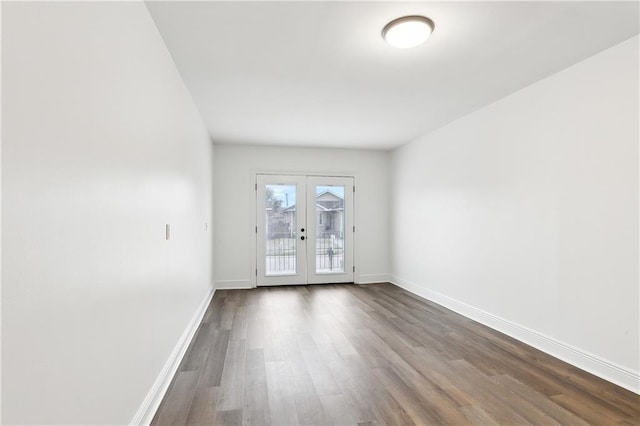 unfurnished room featuring hardwood / wood-style floors and french doors