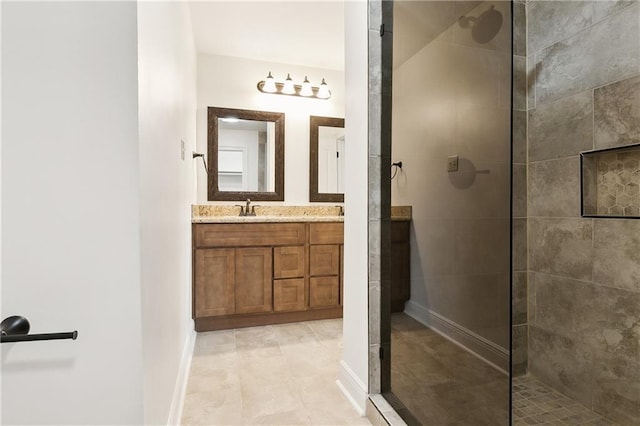 bathroom featuring vanity and a tile shower