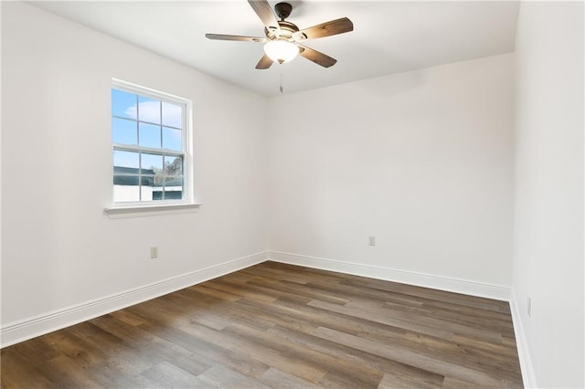 spare room featuring wood-type flooring and ceiling fan