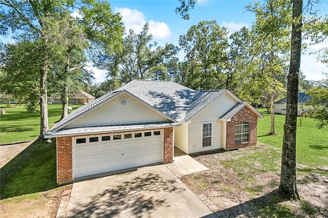 view of front of house with a garage and a front yard