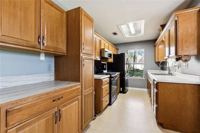 kitchen with sink and black appliances