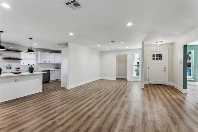 unfurnished living room with light hardwood / wood-style flooring