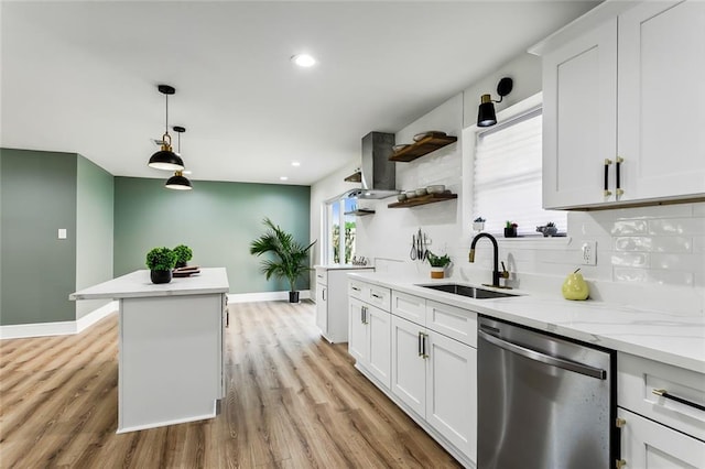 7470 Briarheath Dr, New Orleans, LA 70128 - kitchen featuring dishwasher, a sink, baseboards, backsplash, and light wood finished floors