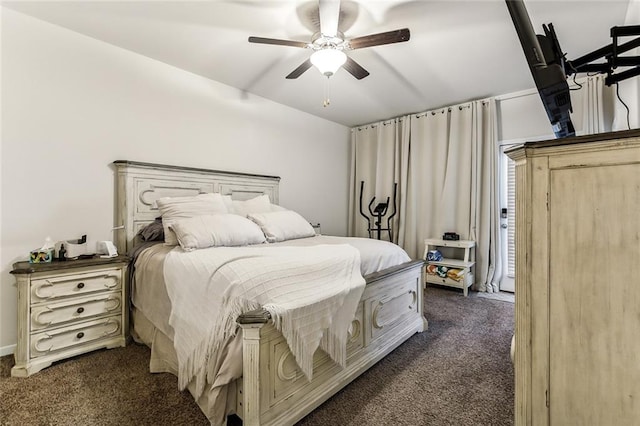 bedroom featuring ceiling fan and dark carpet