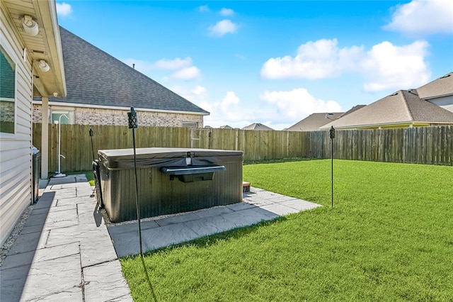 view of yard with a patio and a hot tub