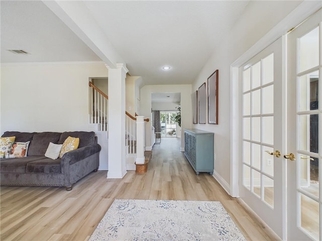 1024 Claire Dr, Slidell, LA 70461 - hallway featuring light wood-style floors, stairs, and ornamental molding