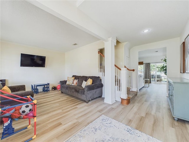 1024 Claire Dr, Slidell, LA 70461 - living room featuring stairway, light wood-style flooring, and recessed lighting