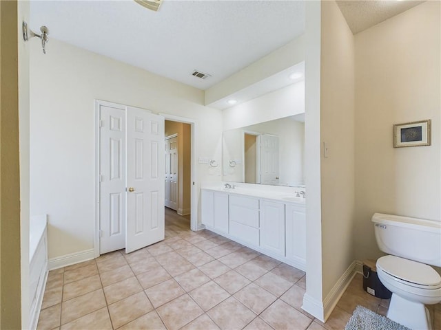 1024 Claire Dr, Slidell, LA 70461 - full bathroom featuring double vanity, tile patterned floors, and a bathtub
