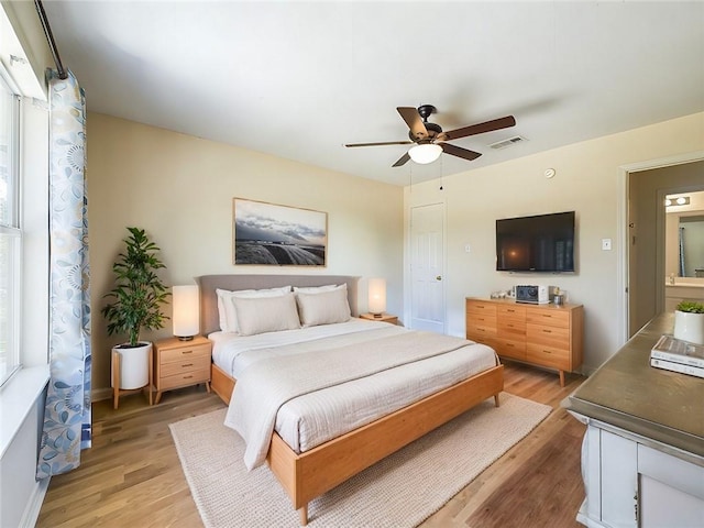 1024 Claire Dr, Slidell, LA 70461 - bedroom featuring light wood-type flooring and ceiling fan