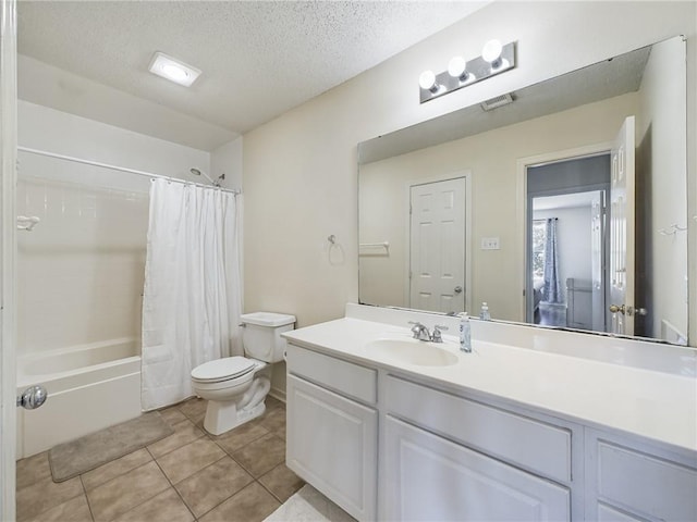 1024 Claire Dr, Slidell, LA 70461 - full bath with vanity, shower / tub combo with curtain, tile patterned floors, and a textured ceiling
