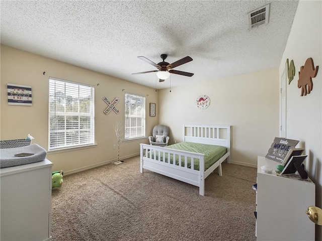 1024 Claire Dr, Slidell, LA 70461 - carpeted bedroom featuring a textured ceiling and a ceiling fan
