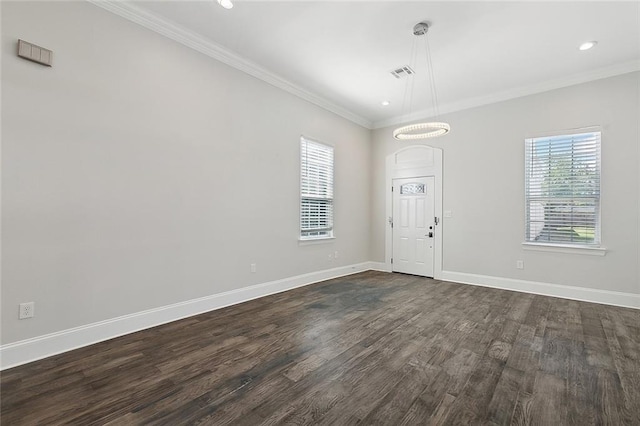 empty room with crown molding and dark wood-type flooring