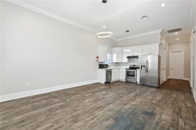 kitchen with dark wood-type flooring, hanging light fixtures, stainless steel appliances, crown molding, and white cabinets