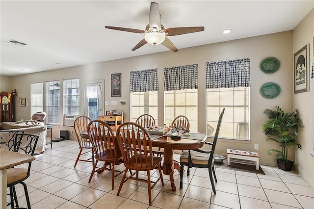 dining area with ceiling fan, cooling unit, and light tile patterned floors