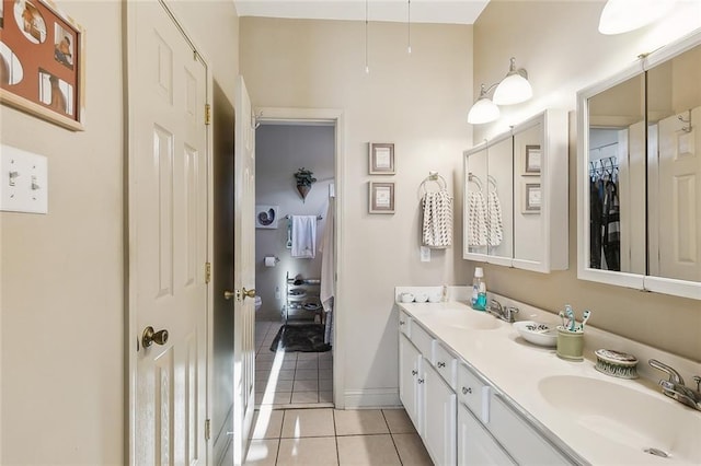 bathroom with tile patterned flooring and vanity