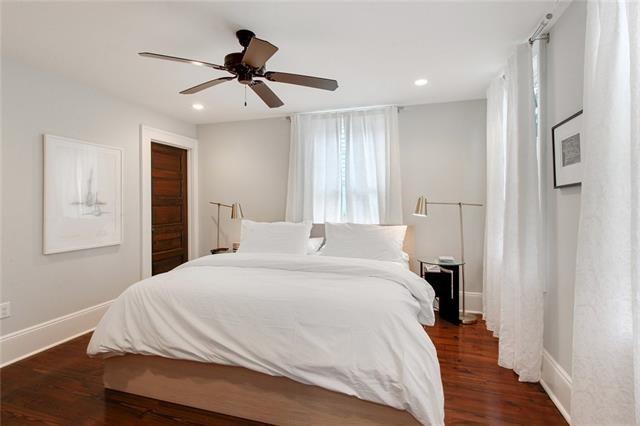 bedroom featuring ceiling fan and dark wood-type flooring