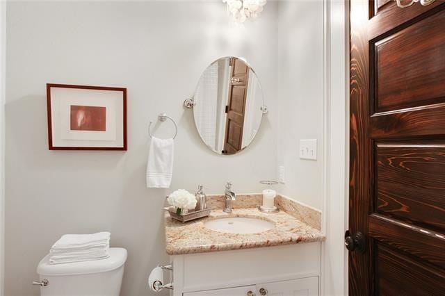 bathroom with vanity and toilet