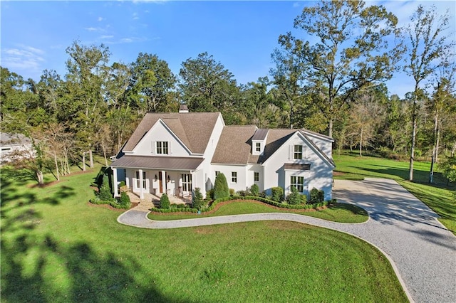 view of front of property featuring a porch and a front yard