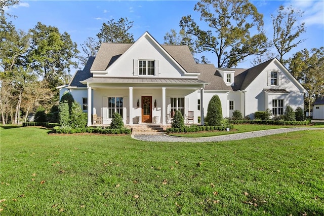 view of front of house featuring a porch and a front yard