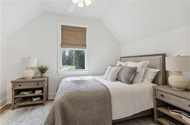 bedroom featuring ceiling fan, wood-type flooring, and lofted ceiling