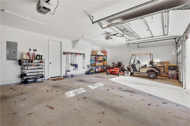 garage with electric panel and a garage door opener