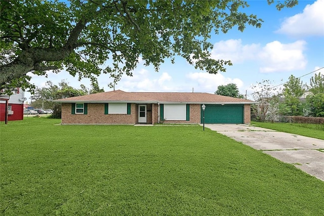 ranch-style home with a front lawn and a garage