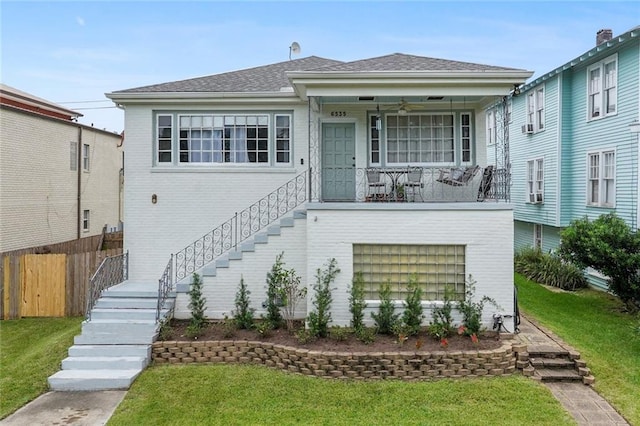 view of front of house featuring a porch and a front lawn