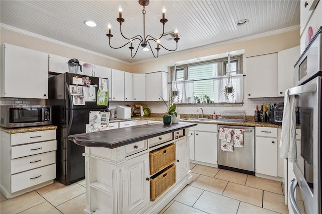 kitchen with a center island, white cabinets, and appliances with stainless steel finishes