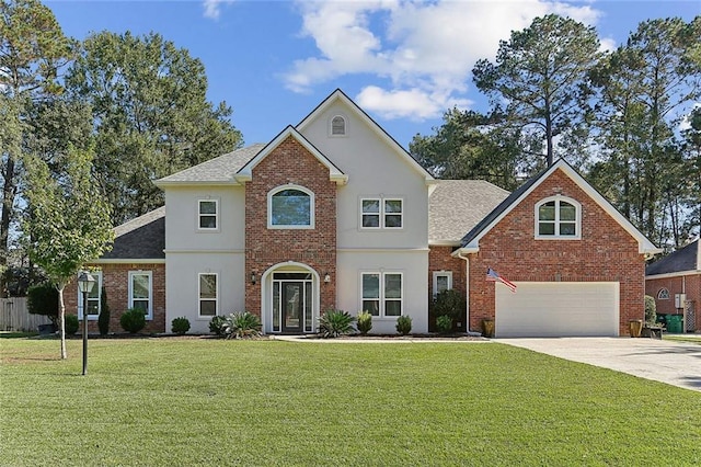 view of front of house featuring a garage and a front lawn