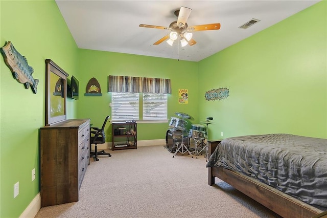 bedroom featuring ceiling fan and light carpet