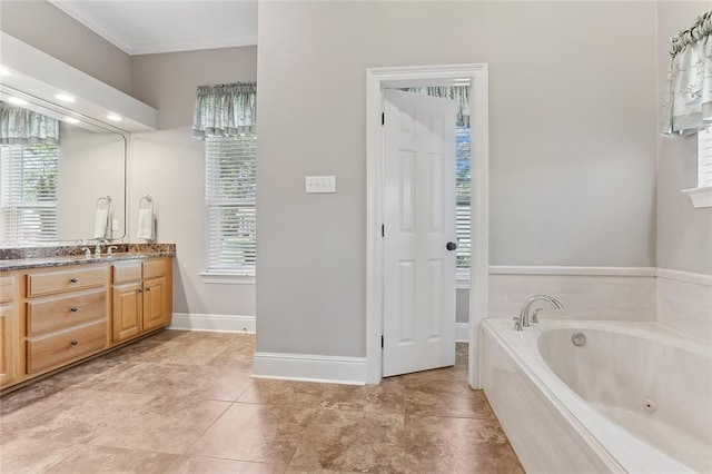 bathroom featuring vanity, tile patterned floors, ornamental molding, and a tub