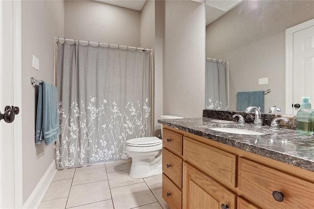 bathroom with vanity, tile patterned floors, and toilet