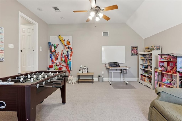 game room featuring ceiling fan, vaulted ceiling, and light carpet