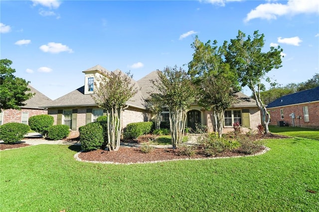 view of front of home with a front lawn