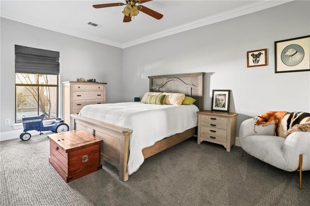 carpeted bedroom with ceiling fan and ornamental molding