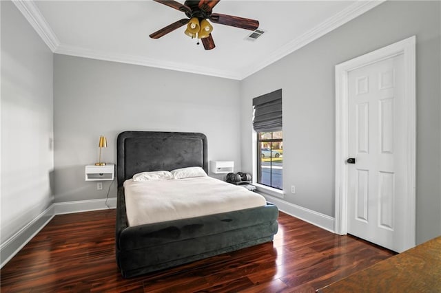 bedroom featuring ceiling fan, crown molding, and dark wood-type flooring