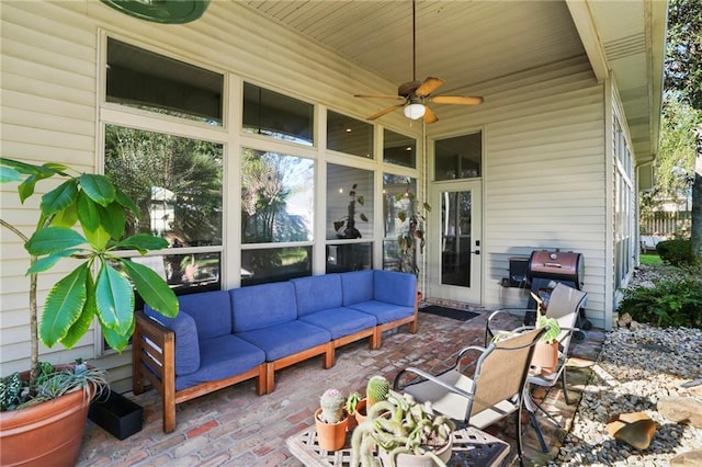 view of patio / terrace with ceiling fan, a grill, and an outdoor living space