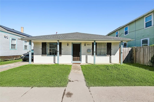 view of front of property with a porch and a front yard