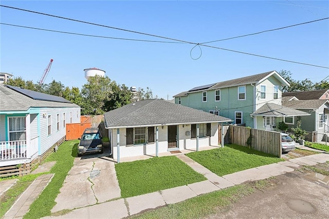 view of front facade with covered porch and a front yard