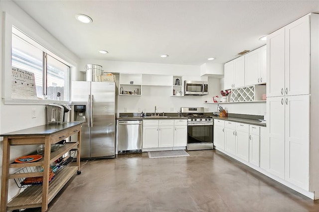 kitchen featuring white cabinets, sink, and stainless steel appliances