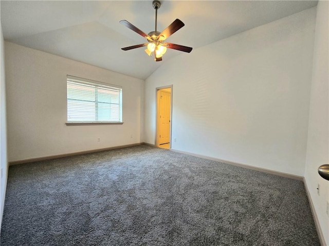 carpeted spare room with ceiling fan and lofted ceiling