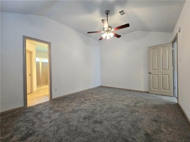 empty room featuring ceiling fan, light colored carpet, and vaulted ceiling